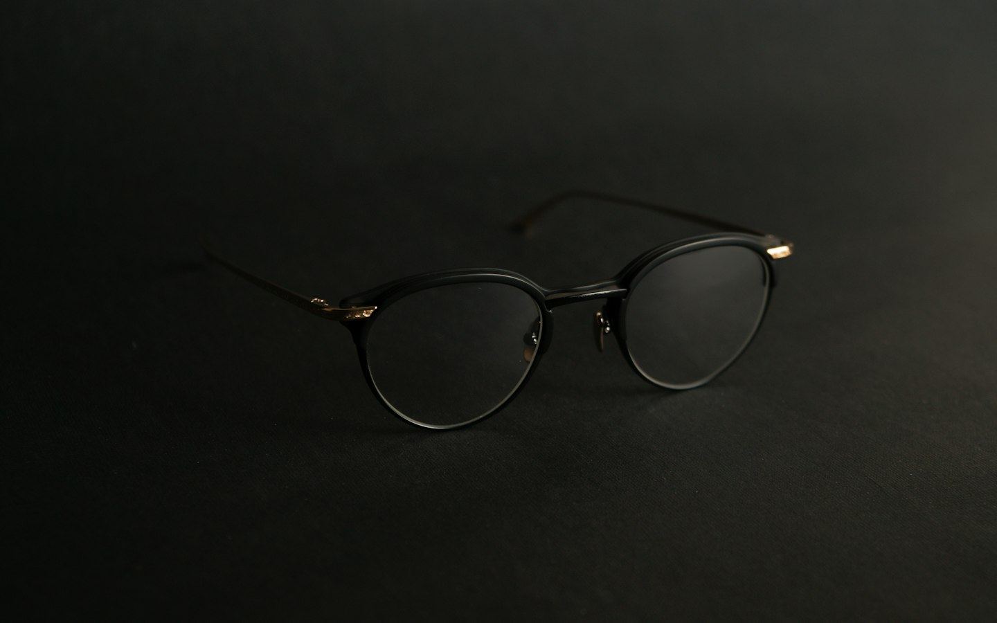 Thin metal frames on a black surface