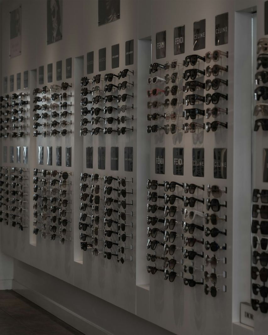 Wall of frames in a dark showroom